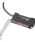 PNP Optical Fiber Amplifier Sensor E3X NA41 with adjustable sensitivity for precise sensing, shown with clear fiber optic cable attachment.