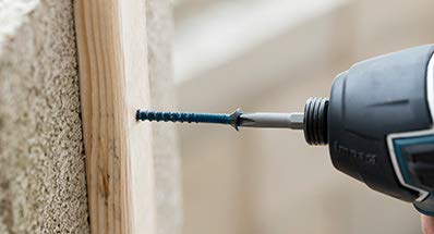 One Quarter Inch By Three And One Quarter Inch Tapcon Hex Washer Head Concrete Screw for anchoring to masonry brick or block visible in drill