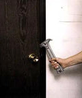 Person holding Emergency Gas Shut Off 4 In 1 Tool For Home Safety And Disaster Prep Gas And Water Valve Wrench against a door