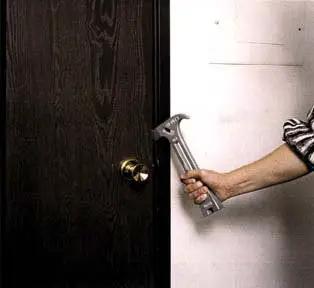 Person holding Emergency Gas Shut Off 4 In 1 Tool For Home Safety And Disaster Prep Gas And Water Valve Wrench against a door