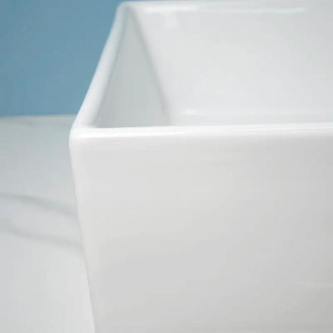 Close-up view of USZWBY Vessel Sinks Modern Minimalist Home Balcony Ceramic Wash Basin with a square flat bottom.