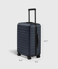 Bigger Carry On Luggage From Away, lightweight hardside navy suitcase with spinner wheels, TSA lock, and polycarbonate shell