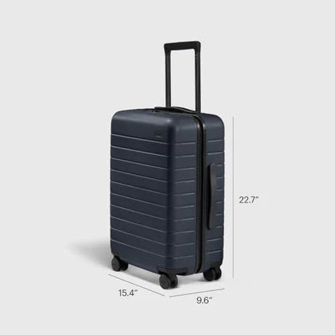 Bigger Carry On Luggage From Away, lightweight hardside navy suitcase with spinner wheels, TSA lock, and polycarbonate shell