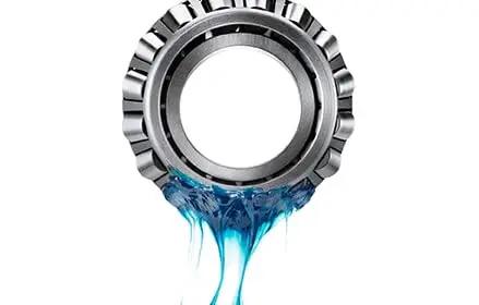 Blue Lithium Complex Electric Motor Grease Cartridge, 13.7 Oz, NLGI Grade 2, Mineral Base Oil being applied to a metal bearing