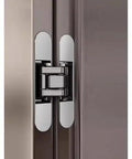 Heavy Duty Silent Pivot Hinge With Soft Close Concealed Hardware For Wood And Folding Doors In Silver installed on cabinet.