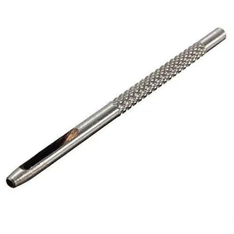 Close-up of metal punch tool from Pro Grade Heavy Duty Die Punch Snap Kit Rivet Setter With Base. Textured grip and tapered tip visible.