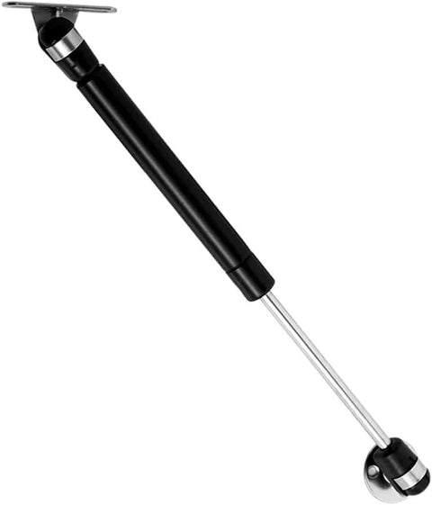 Angled side view of a black 6-inch gas strut for cabinet doors, chrome rod and mounting ends.