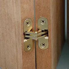Invisible Hinge For Cabinets And Panels SOSS One Half Inch By Two And Three Eighths Inch Pair Brass Finished Zinc between wood panels