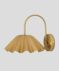 SHAHLUMES Handcrafted Curved Brass Flower Wall Sconce in matte black, elegantly curved design, ideal for bedroom or hallway lighting.