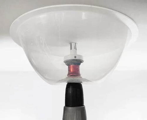 Dust bowl attachment for hole saws; collapsible clear plastic bowl for installing recessed lights.