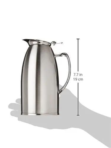 Top Shelf Double Wall Insulated Twenty Ounce Stainless Steel Coffee Server with lever handle shown in hand for scale.