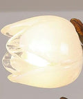 Close-up of Top Shelf Chinese Magnolia Branch Chandelier lightbulb with smooth anti corrosion finish and organic design.