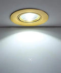 9-Pack of 3-Inch Brass LED Recessed Lights, Round Retrofit Ceiling Fixtures with Lush Gold Trim, Flat Baffle Spotlight illuminated on ceiling.
