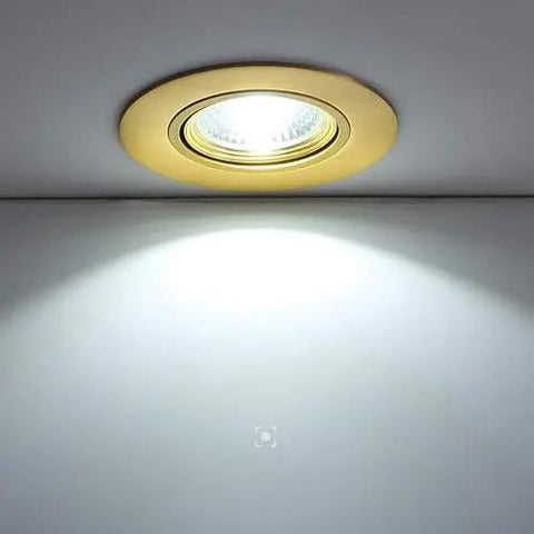 9-Pack of 3-Inch Brass LED Recessed Lights, Round Retrofit Ceiling Fixtures with Lush Gold Trim, Flat Baffle Spotlight illuminated on ceiling.