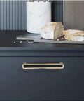 2 Pack 5.0 Inch Hole Center Zinc Alloy Square Cabinet Handles In Black Gold Finish installed on kitchen drawer.