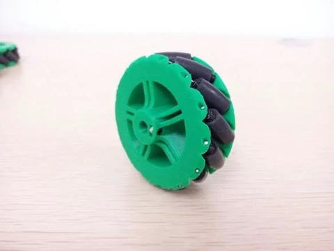 3D-printed mecanum omni wheel, green plastic hub with black rubber rollers, 64mm diameter