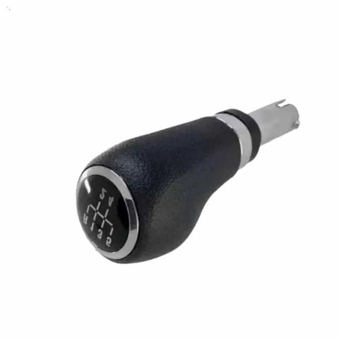 Upgrade Your Ride With This Sleek Black Gear Shift Handle Lever And Gaitor Assembly Perfect For Chevrolet Trax Models From 2011 To 2020 Adds Instant Style And Smooth Shifting Control To Your Interior Without Breaking The Bank. black ABS gear shift knob with 5-speed pattern, angled view