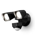 Real Talk Hardwired Outdoor Security Floodlight Camera Offers Sharp Motion Detection And Flawless Smart App Tie Ups For Rock Solid Fence Line Coverage And Nasty Weather Resistance, sleek black dual light and motion sensor.
