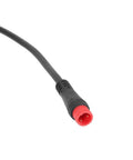 Red and black electric scooter cable connector, detail view