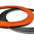 Two 3-1/2-inch circular gaskets, silicone rubber and graphite, orange and gray, for vacuum casting perforated flasks.