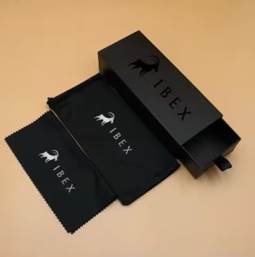 Black IBEX-branded box and cloth pouch for sunglasses set on a beige background