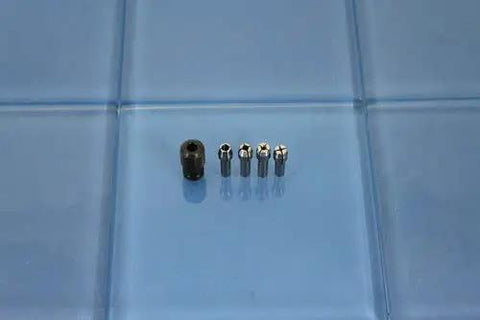 Quick Change Collet Nut Kit Set 4485 Durable For Dremel And Other Rotary Tools With Three Quarters Inch Collets on blue surface