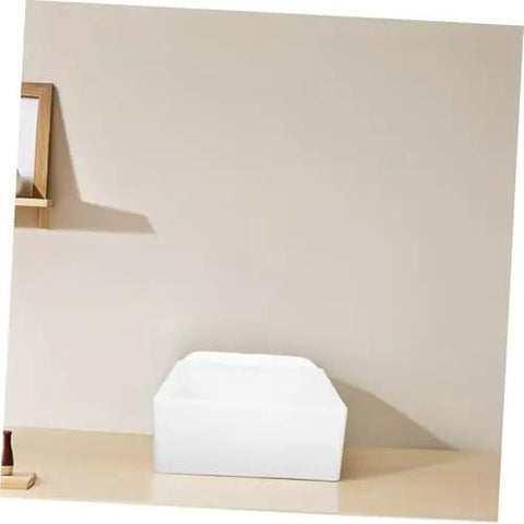 Wall-Mounted Bathroom Sink - Space-Saving Plastic Wash Basin for Small Restrooms, No-Drill Installat, front view against beige wall.