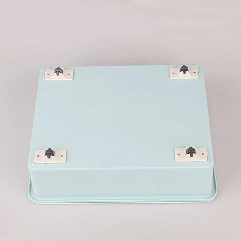 Four Pack Self Adhesive Directional Caster Wheels For Kitchen Cabinets Drawer Units And Storage Bins Hella Smooth Ball Bearings attached to a blue storage box.