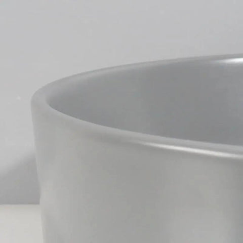 Close-up of USZWBY Vessel Sinks Ceramic Vessel Sink Simple Round Matte Gray, showing smooth edge detail.