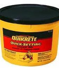Fast Fix Heavy Duty Quick Setting Cement Bag Gray Concrete Mix Quick Dry Formula for driveway repair in a yellow bucket.