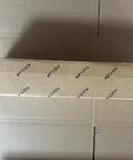 Front view of KRETLAW grease gun kit packaging box with branded tape.