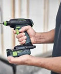 Professional 18V Cordless Drill And Driver Tool With Quick Change Chuck System in hand, ideal for versatile wood and metal work.