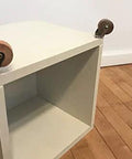 Brown Wood Wheel Stem Casters Set Of Two With Friction Mount For Lightweight Furniture shown installed on wooden box.
