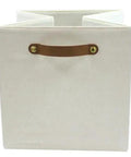 A Straight Up Game Changer Collapsible Fabric Cube Storage Bin Vanilla Canvas Organizer Tote with sturdy handle for easy carrying.