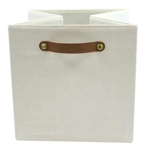 A Straight Up Game Changer Collapsible Fabric Cube Storage Bin Vanilla Canvas Organizer Tote with sturdy handle for easy carrying.