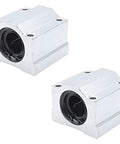 Rugged And Reliable Heavy Duty Smooth Glide Linear Motion Ball Bearing Slide Block Bushing For SCS20UU Linear Shaft CNC And 3D Printer Mods In Clean Silver, two pieces shown.