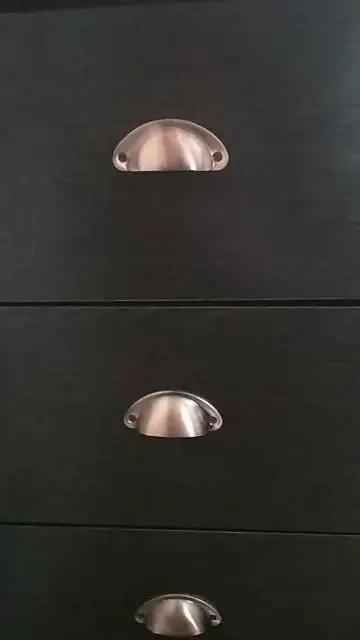 Upgrade Your Home With Hella Sturdy Iron Cup Pulls Featuring A Classic Vintage Shell Shape And Smooth Red Copper Brushed Finish Perfect For Dressers And Kitchen Drawers Ten Piece Kit on black drawers.