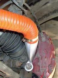 SCAT Flex Duct Silicone Impregnated Fiberglass With Steel Wire Reinforcement for Intake installed in vehicle engine bay, red