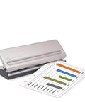 Metal hole punch for pocket and compact planners with spill proof chip collector and rubber non-slip base, shown with punched page.
