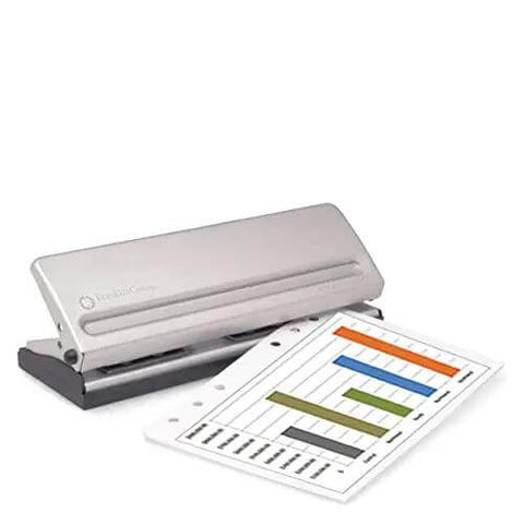 Metal hole punch for pocket and compact planners with spill proof chip collector and rubber non-slip base, shown with punched page.