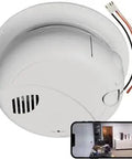 Keep Tabs On Your Space With This Snap 4K Wireless Smoke Detector Camera Hardwired To 120V AC For Ceiling Install, showing the camera's white design.