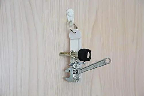 Two Pack Magnetic Security Key For Slatwall And Peg Hook Displays, Anti Theft Magnet Key on wooden surface with tools