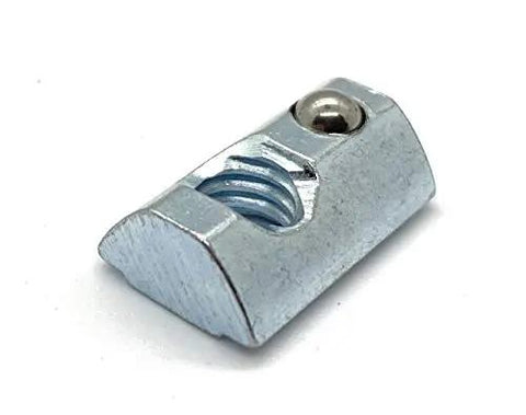Close-up of Roll-In T-Nut with Ball Spring 5/16-18, zinc material, showing threading and ball spring detail. Compatible with 15 Series, 13040 profile.