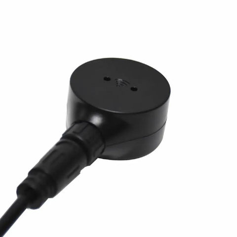 Close-up of Non Contact Ultrasonic Fuel Level Sensor For Universal Fuel Gauge Compatibility, black cylindrical shape with cable.