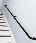 Premium Black Metal Stair Handrail With Heavy Duty Wrought Iron Brackets For Indoor And Outdoor Use installed on a wall.