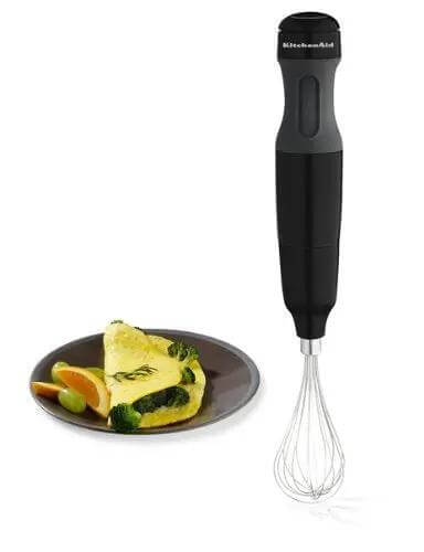 Powerhouse 3 Speed Hand Blender With Soft Grip Handle In Onyx Black Includes Removable Blending Arm Whisk Attachment And BPA Free 2 Cup Chopper Bowl For Crush Chop Puree And Whisk Jobs With Zero Hassle next to a plate of omelette.