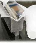 Six Inch By 0.030 Inch By 100 Foot Urethane Die Protection Film for press brakes on metal surface