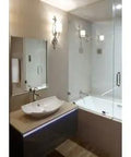 Modern bathroom with a tub featuring Tough As Nails Nickel Bathtub Overflow Drain With 1 1 2 Inch Slotted Plug and brass fittings.