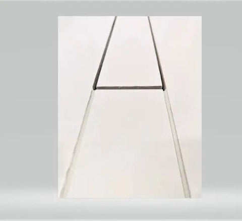 Heavy Duty Linear Shower Drain For Tile Floors Featuring A Slick Brushed Finish and Rock Solid Hair Catcher Grates detail close-up.