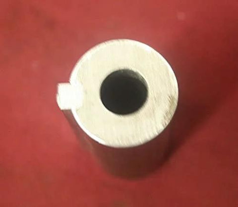 Front view of a silver alloy steel crank shaft adapter with central bore and small side tab